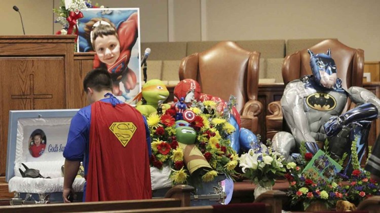 superman looking over casket