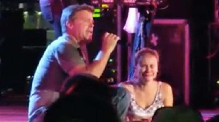 lonestar sitting with crying girl onstage