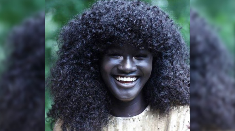 girl with dark skin smiling