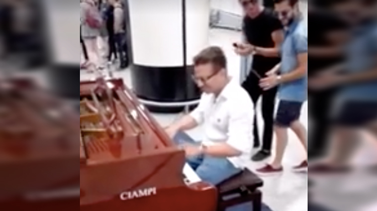 pianist with sunglasses on piano