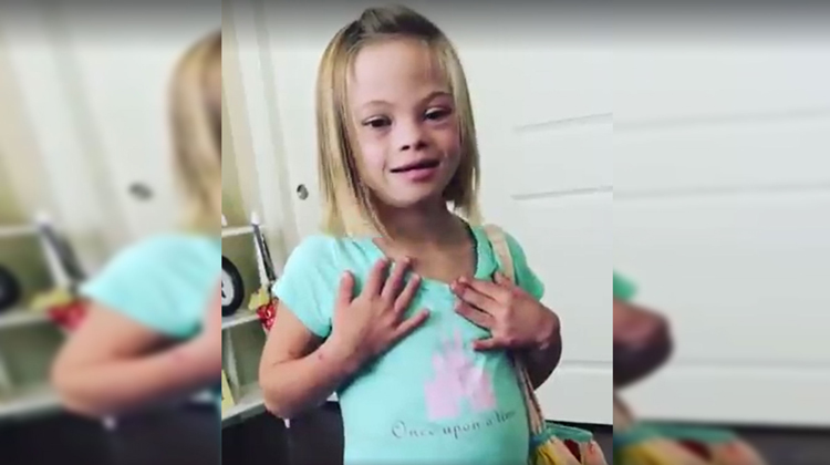 little girl pointing to chest