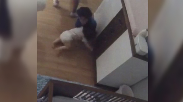 boy catching baby brother