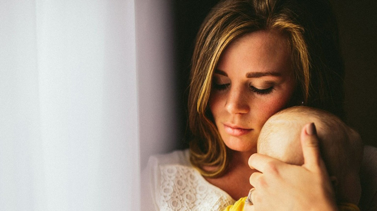 mother holds little baby