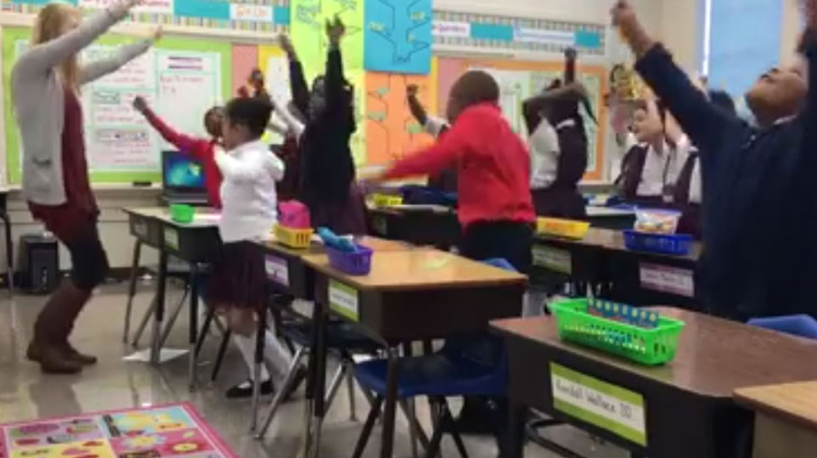 teacher dances with class