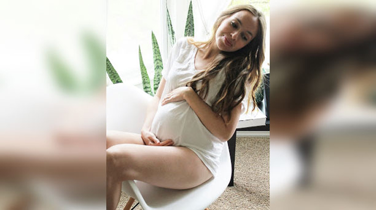 pregnant mother in white dress