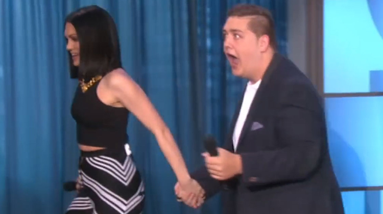 jessie j in black crop top holding toms hand