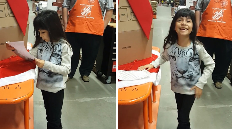 little girl reads letter at home depot
