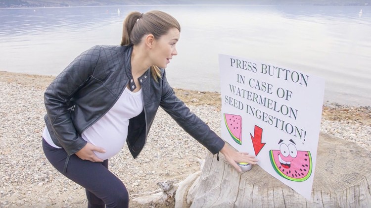 pregnant mom presses watermelon button