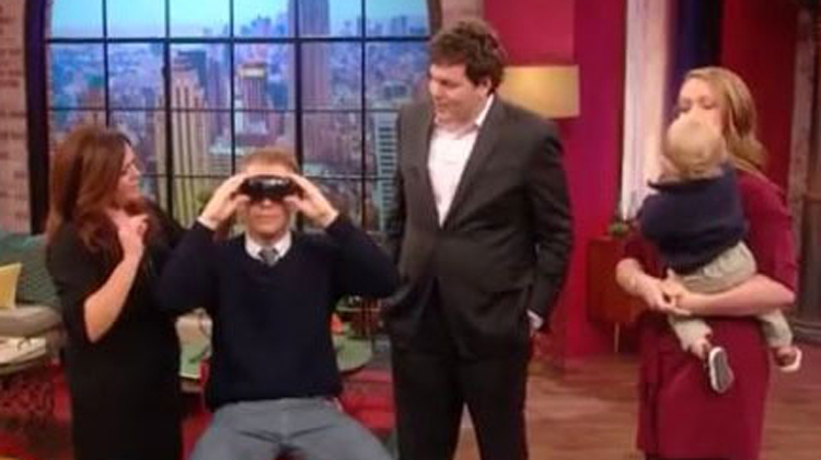 rachel ray show with blind man trying on glasses and family