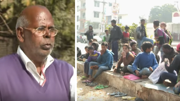 man and kids sitting on sidewalk