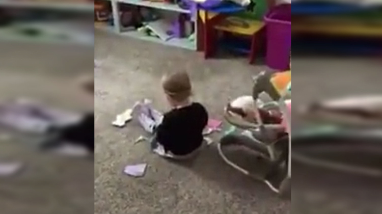 mom sneaking up on little girl in playroom