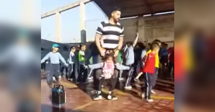 teacher helps student dance