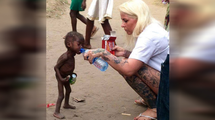 starving baby and blonde nurse giving him water