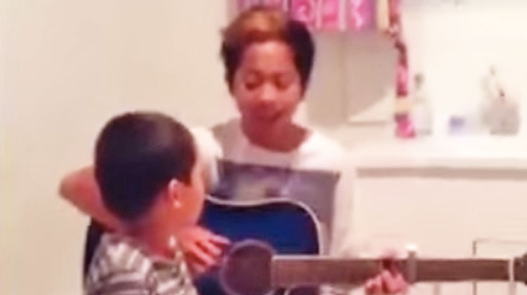 sons singing in bathroom with guitar