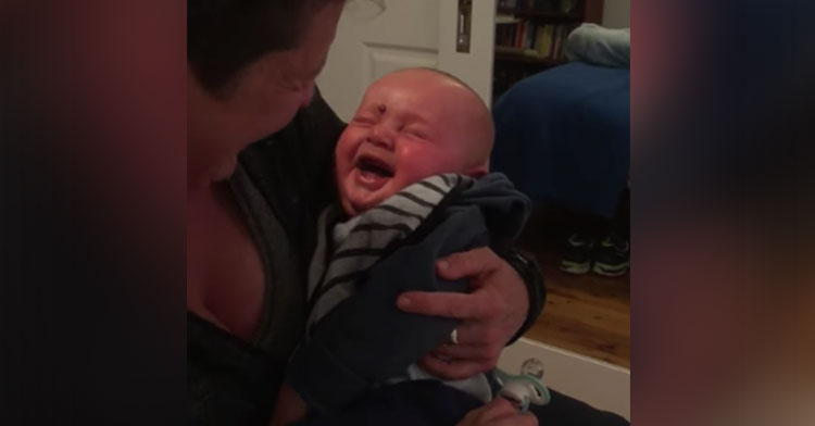 baby cracks up at pacifier