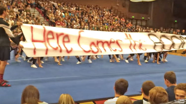 pep rally inside school with banner