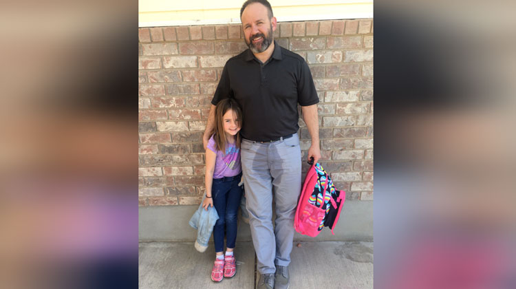 dad with water stain on pants with daughter