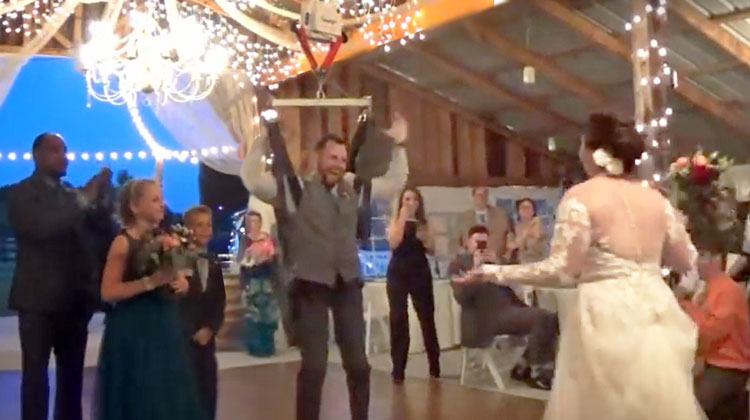 paralyzed groom standing with surprised bride walking towards him