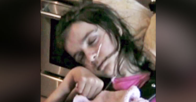 girl lying in hospital bed