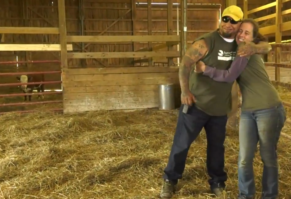 farm sanctuary staff hug