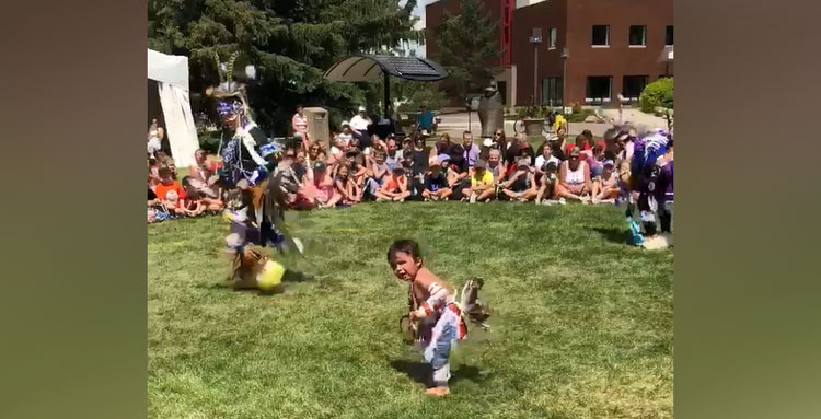 little boy dancing at pow-wow