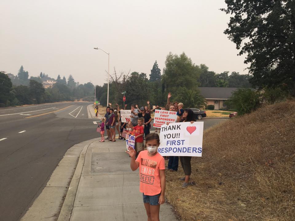 redding residents with signs
