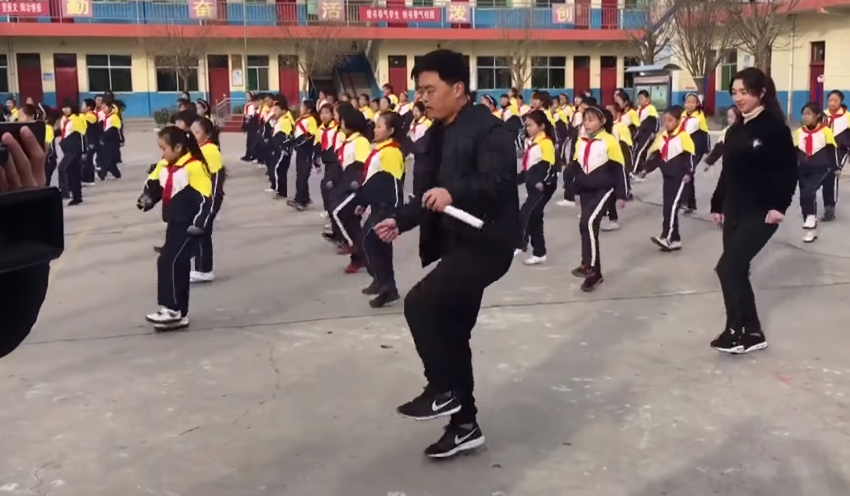 students dance with principal