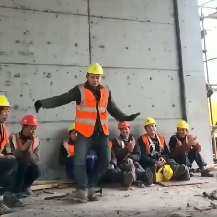 construction worker dances