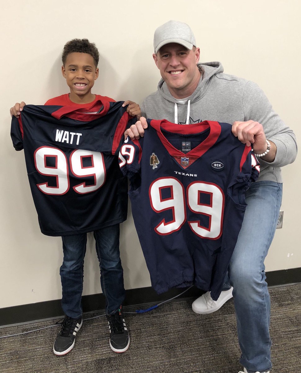 brock and watts hold up jerseys
