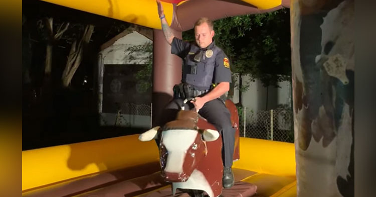 cop rides mechanical bull