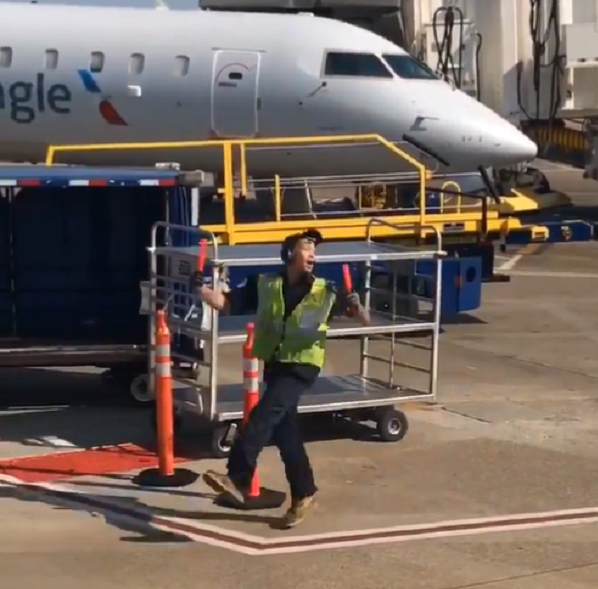 baggage claim handler dancing