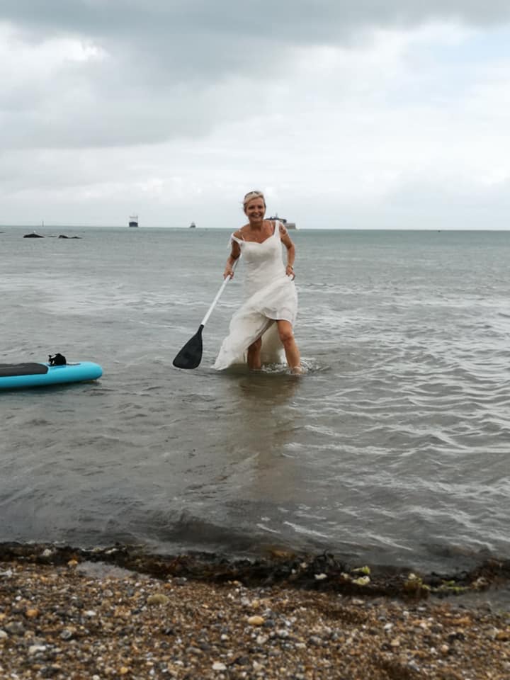 wedding dress paddleboarding