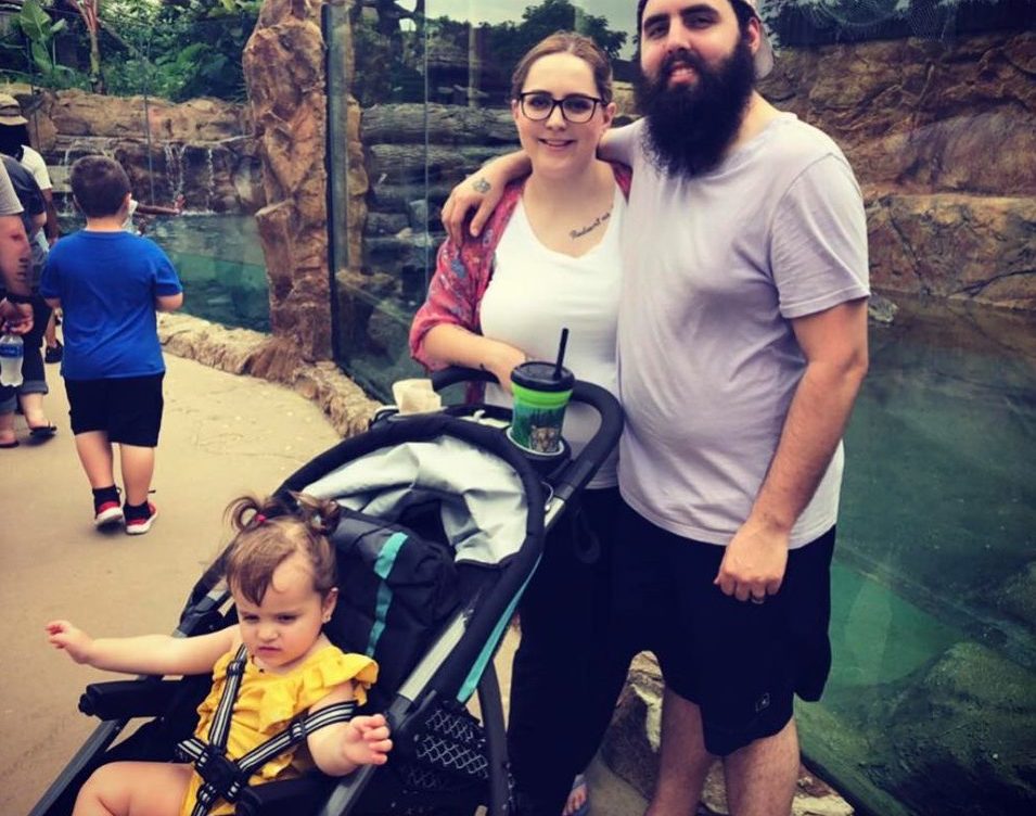 Mom takes photo of her adopted daughter and two foster sons playing in a park