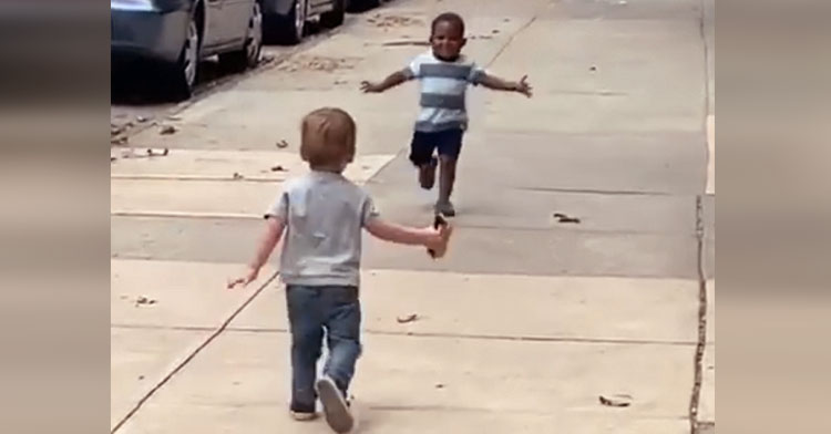 little boys running hug