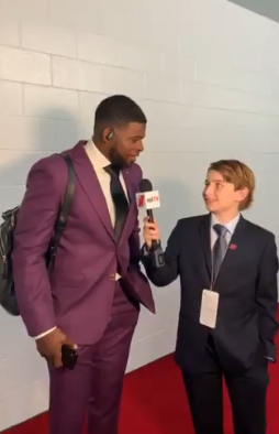 kid reporter interviews hockey player