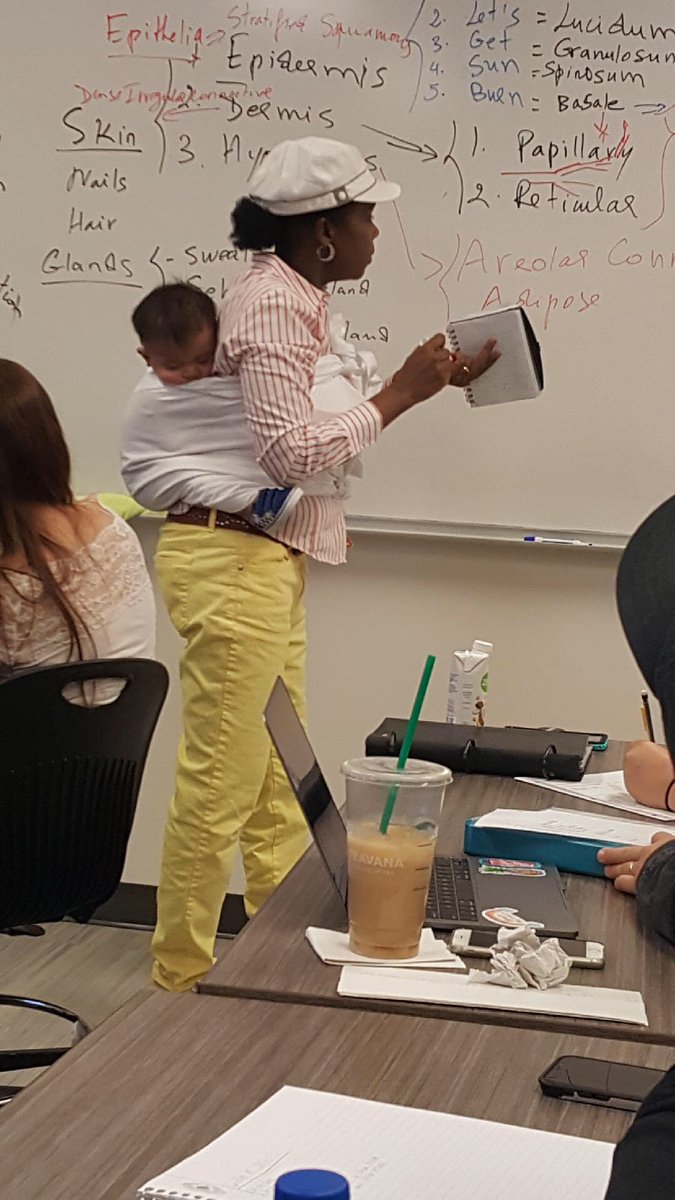 Professor Cissé holds baby