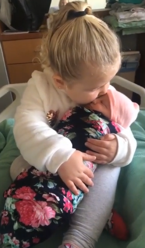 molly kisses baby sister