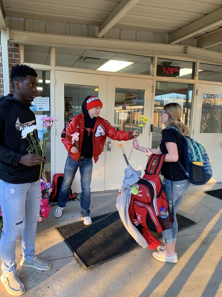 jayme hands out flowers