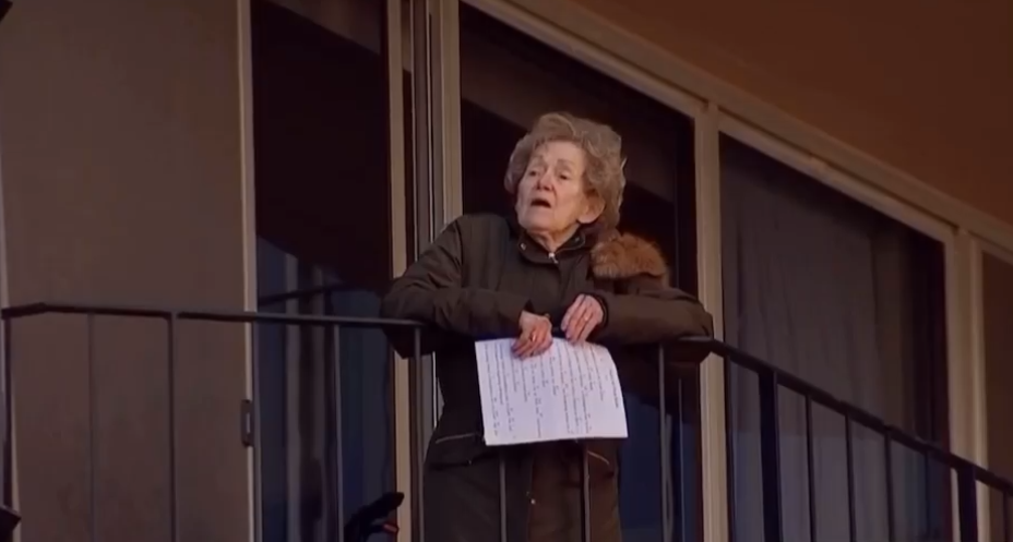 seniors sing from balconies