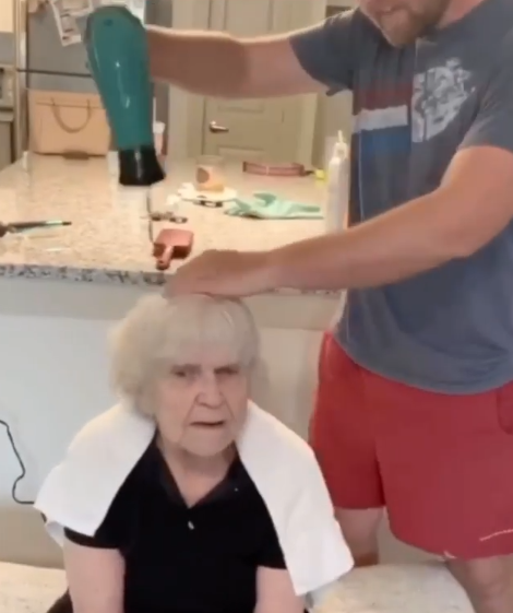 grandson dries grandma's hair