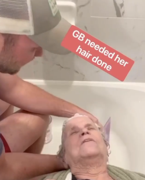grandson washes grandma's hair