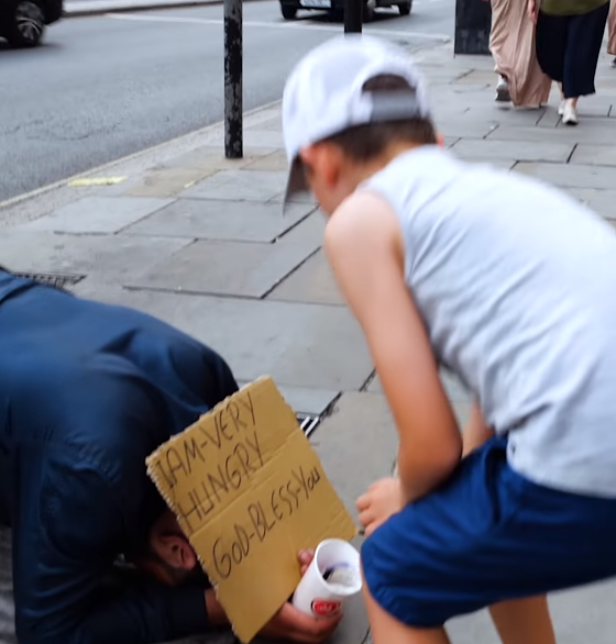 bailey gives money to homeless man
