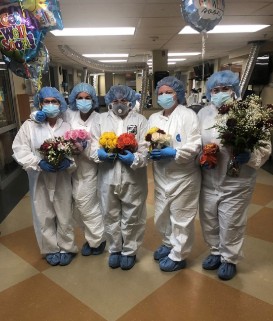 nurses hold bouquets