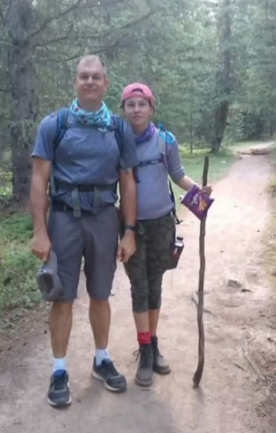 john hiking with his daughter