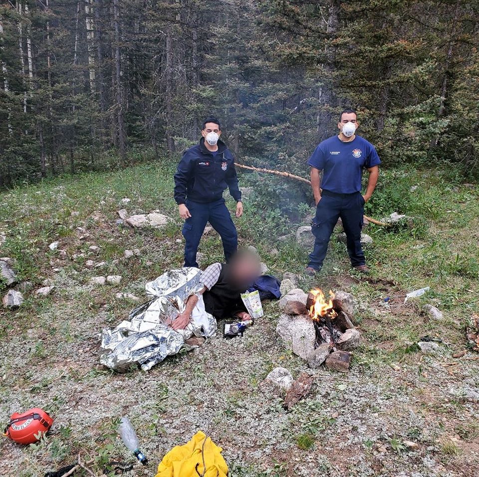 firefighters with hiker