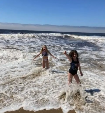 haylee playing on beach