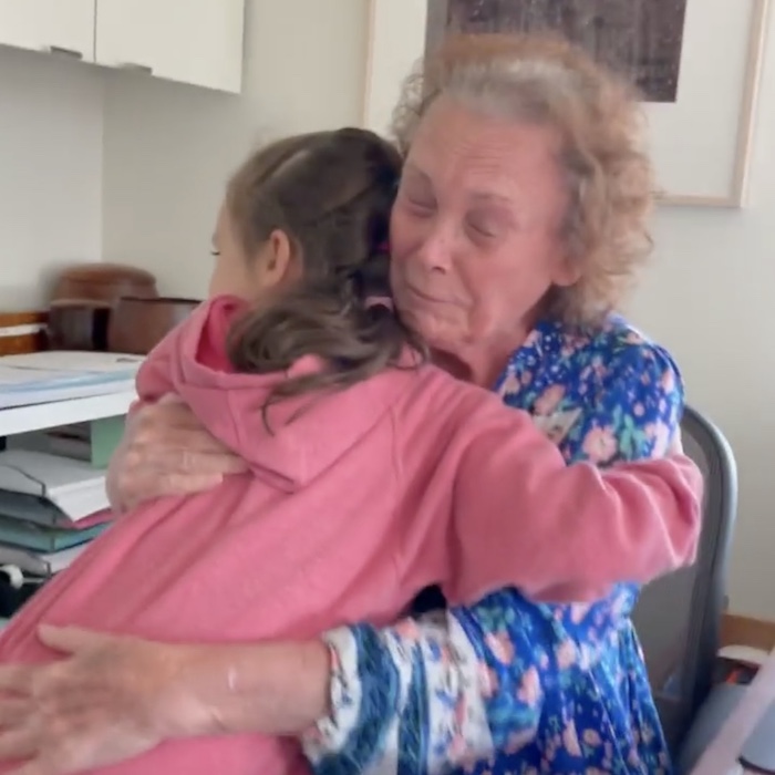 granddaughter hugging grandma