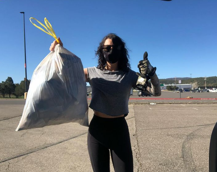 woman holding trash