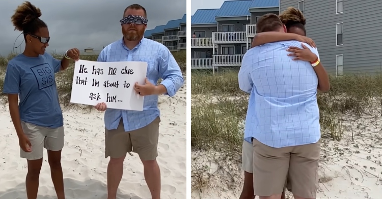 teen standing next to foster dad holding sign on beach