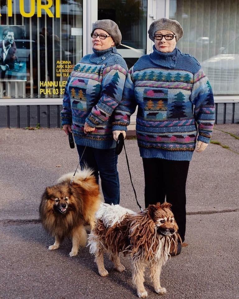 woman and dog standing with crochet versions of herself and her dog